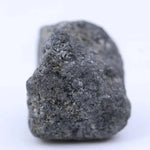 Close-up of gray diamond gemstone showing natural tone and sparkle