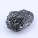 Natural black diamond loose gemstone with deep dark color and raw crystal texture.
