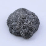 uncut raw diamond ring and raw gemstone collection black grey rough diamond