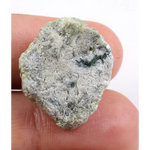 Green rough diamond displayed as a natural loose diamond with irregular diamond shape and raw crystal texture. This real natural diamond stone is uncut and untreated, making it ideal for custom diamond for ring designs, collectors, and buyers seeking authentic green rough diamond material.