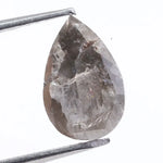 Pear cut natural diamond set in a real natural diamond ring, showcasing precision cutting and natural brilliance.