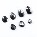 natural pear cut diamond black diamond what is a black diamond, diamond ring, how to tell if a diamond is real, lab grown vs natural diamond, raw diamonds, man made diamonds, GIA certified diamonds, buy loose diamonds.