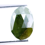 1.55 Ct natural olive green oval cut diamond loose gemstone with visible natural inclusions and faceted surface