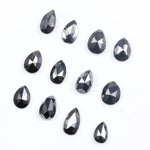 Natural Pear Cut Fancy Black Diamond Engagement Ring, how can you tell if a diamond is real, diamonds in the rough, raw diamonds, lab grown vs natural diamond, natural diamond vs lab grown.