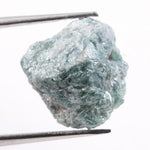 Irregular diamond shape raw diamond stone featuring smooth diamonds areas and rough crystal edges. This rough uncut diamond is perfect for loose diamond buyers