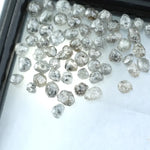 Natural grey white rough diamond lot with mixed silver smoky tones, raw uncut loose diamond crystals displayed on white background.