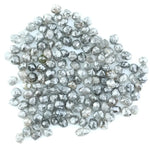 Mixed silver smoky raw uncut loose diamond crystals in natural grey and translucent white tones, rough earth-mined diamonds for jewelry making.
