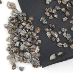 brown grey natural diamond with an untreated rough surface for jewelry creation