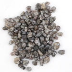 brown grey natural diamond with an untreated rough surface for jewelry creation
