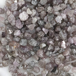 natural pink raw diamond with an unpolished rough surface for jewelry design