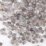 natural pink raw diamond with an unpolished rough surface for jewelry design