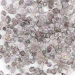 natural pink raw diamond with an unpolished rough surface for jewelry design
