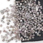 natural pink raw diamond with an unpolished rough surface for jewelry design