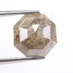 Raw natural diamond in rock showing uncut crystal formation as found in nature. Authentic earth-mined rough diamond before polishing and cutting.