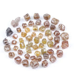 Fancy multi color raw natural diamond lot featuring yellow, brown and golden rough uncut stones