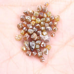 Fancy multi color raw natural diamond lot featuring yellow, brown and golden rough uncut stones
