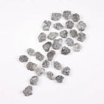 Raw gray silver diamond with shimmering steel-toned surface for custom jewelry