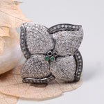 Vintage 4 Petal Pave wedding ring with emerald accents in an Art Deco sterling silver setting.
