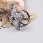 Vintage 4 Petal Pave wedding ring with emerald accents in an Art Deco sterling silver setting.