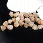 rough diamond , uncut rough diamond, orange raw diamond in matrix and kimberlite, brown diamond