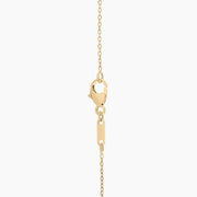 0.18 Ct with gold necklace featuring green gemstone pendant.