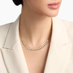 0.49 Ct gold pendant necklace with delicate chain and charm.