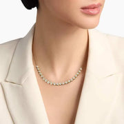 0.49 Ct gold pendant necklace with delicate chain and charm.