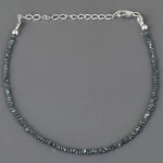 gold cuban bracelet and gold engraved bracelet paired with natural raw diamond bracelet