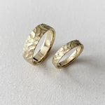Dual-tone couple rings with modern geometric patterns for stylish partners.