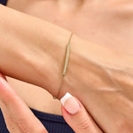 ruby tennis bracelet paired with diamond bracelets womens fashion jewelry and sparkling luxury finish.