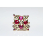 Lab created gemstone diamond ring with pink center stone and sparkling white diamonds in gold setting
