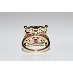 Lab created gemstone diamond ring with pink center stone and sparkling white diamonds in gold setting