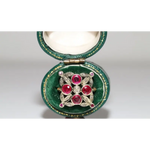 Lab created gemstone diamond ring with pink center stone and sparkling white diamonds in gold setting