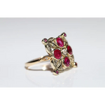 Lab created gemstone diamond ring with pink center stone and sparkling white diamonds in gold setting