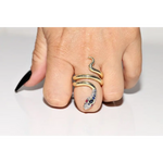Stylish lab created gemstone ring with ruby red center stone and white diamond halo