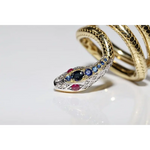 Stylish lab created gemstone ring with ruby red center stone and white diamond halo