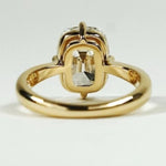 elongated cushion cut diamond ring with twisted yellow gold shank