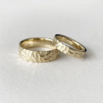 Dual-tone couple rings with modern geometric patterns for stylish partners.