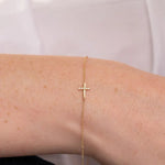 0.60 ct lab grown diamond bracelet for women featuring round brilliant stones in a gold setting.
