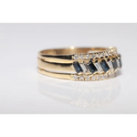 Luxury lab created gemstone ring with emerald cut green stone and diamond accents