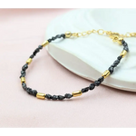 gold bracelet with beads and gold snake bracelet inspired by uncut stones and value collections.