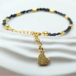 gold bracelet with beads and gold snake bracelet inspired by uncut stones and value collections.