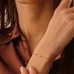 ruby tennis bracelet paired with diamond bracelets womens fashion jewelry and sparkling luxury finish.