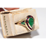 Modern lab created gemstone ring with aquamarine center and brilliant white diamonds