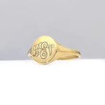 Custom gold initial ring for women with delicate alphabet engraving and sleek signet design