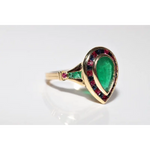 Modern lab created gemstone ring with aquamarine center and brilliant white diamonds