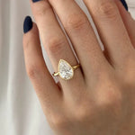 Stunning 2 ct pear shaped diamond ring with elongated design and intense fire