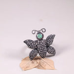Victorian butterfly statement ring in silver with emerald and black diamond accents, gothic nature-inspired insect jewelry for women