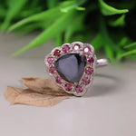 Art Deco silver cocktail ring with black moissanite trillion cut, pink sapphire and ruby halo design, unique statement jewelry for women