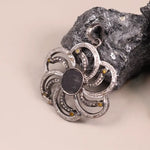 Victorian sterling silver flower pendant with black gemstone, diamond accents, and yellow detailing – handmade statement jewelry necklace